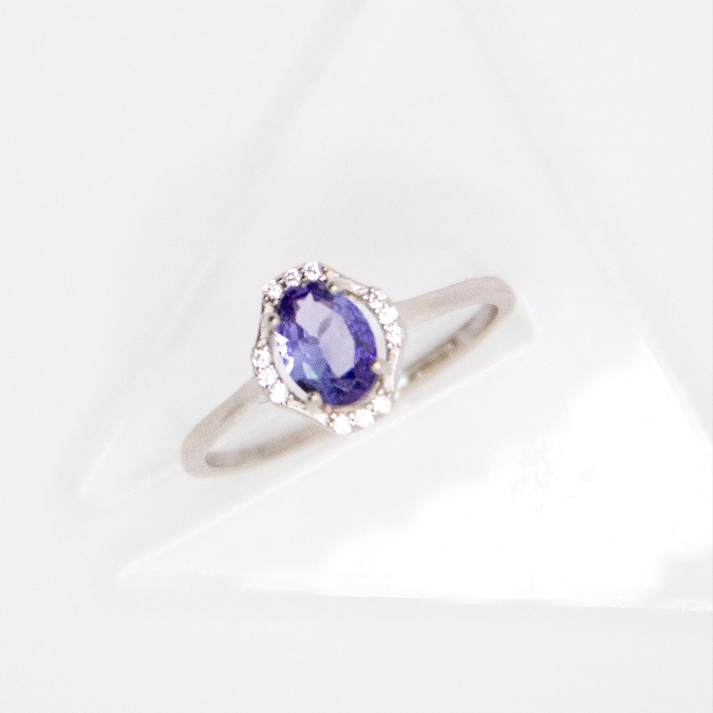 Oval-Cut Tanzanite Ring with CZ Halo