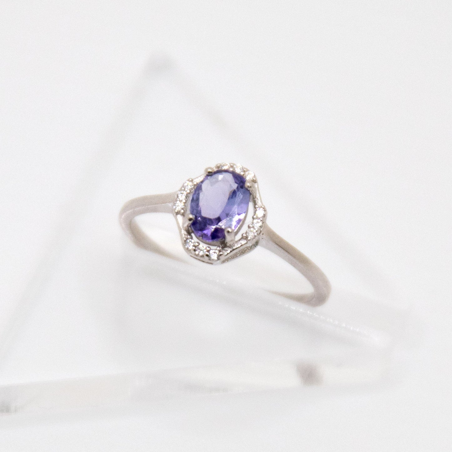 Oval-Cut Tanzanite Ring with CZ Halo